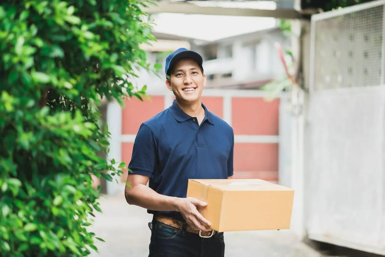 A man holding a box in his hands.